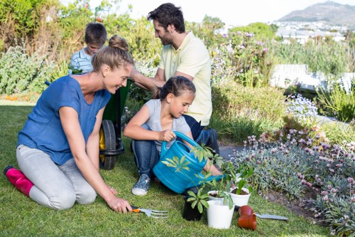 Experienced gardeners in Cudham discussing tailored garden maintenance